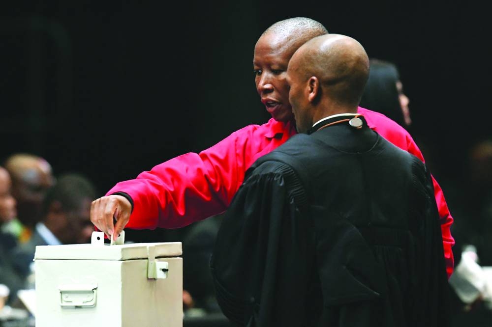 Economic Freedom Fighters leader Julius Malema casts his ballot for Speaker for parliament during the first sitting of the New South African Parliament in Cape Town on Friday.