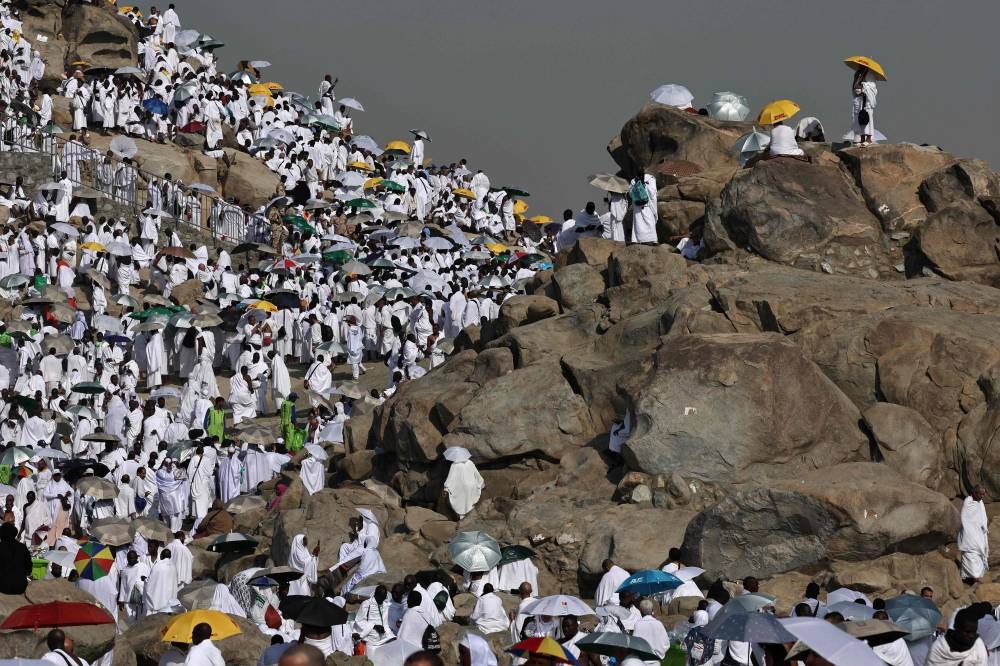 Pilgrims pray at dawn on Saudi Arabia's Mount Arafat, also known as Jabal al-Rahma or Mount of Mercy, during the climax of the Haj pilgrimage on Saturday. AFP