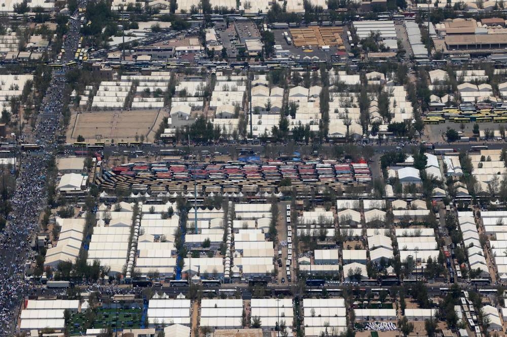 This aerial view shows tents and busses used by pilgrims near Saudi Arabia's Mount Arafat, during the climax of the Haj pilgrimage on Saturday. AFP