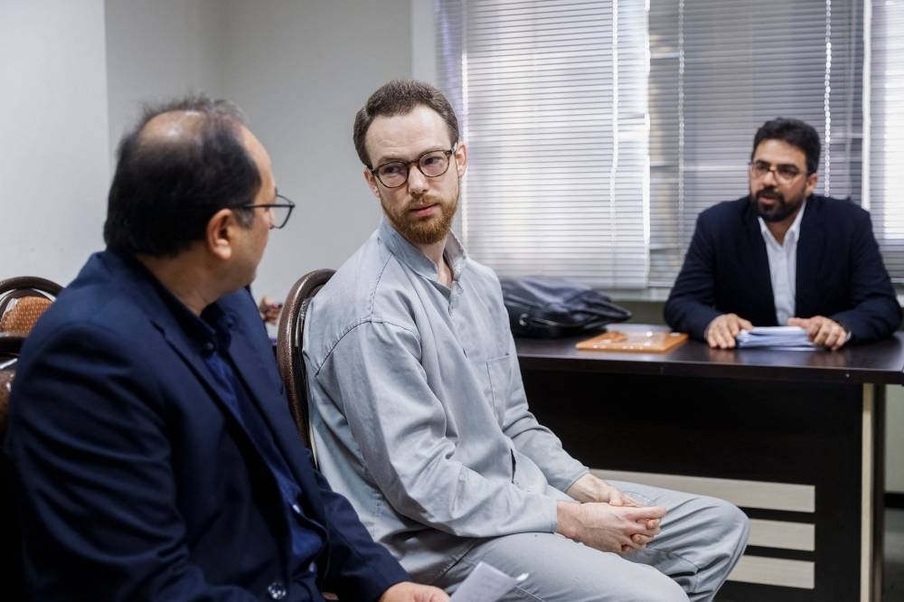 Swedish EU diplomat Johan Floderus (C) attends a court session in Tehran on December 10, 2023. AFP