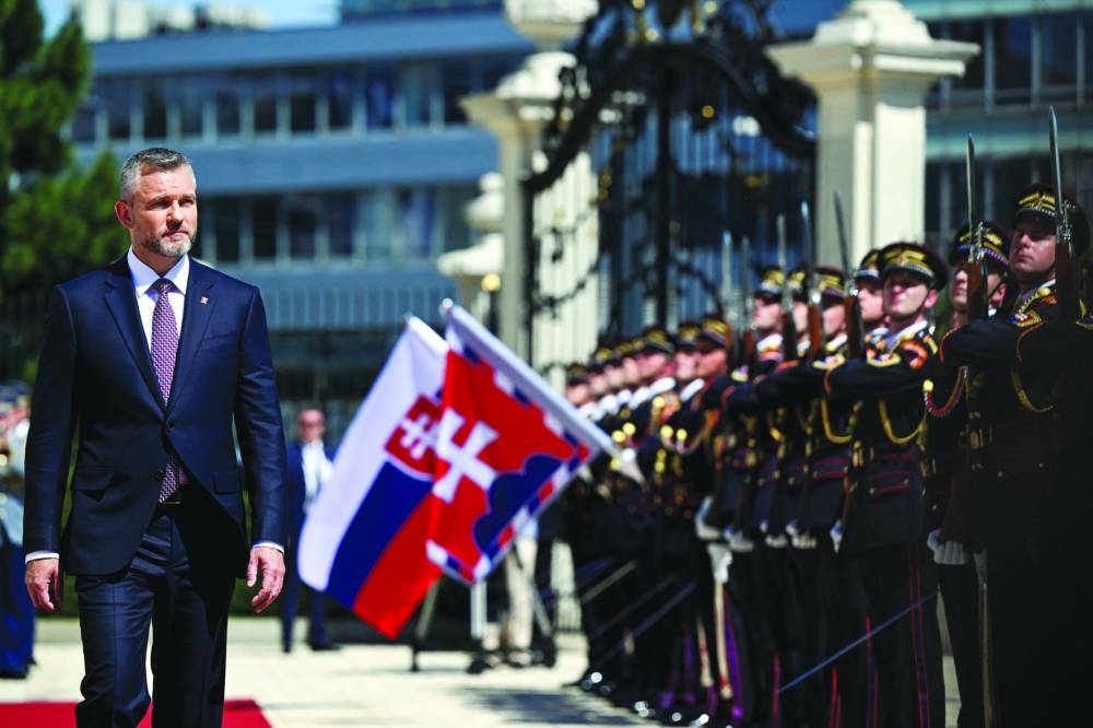Slovakia’s newly elected President Peter Pellegrini reviews the Honour Guard during a ceremony at the Presidential Palace, in Bratislava, Slovakia, on Saturday. (Reuters)