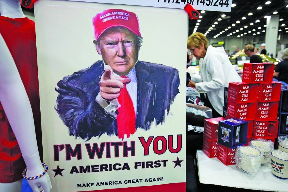 Merchandise promoting Donald Trump is shown at Turning Point Action’s ‘The People’s Convention’ in Detroit.