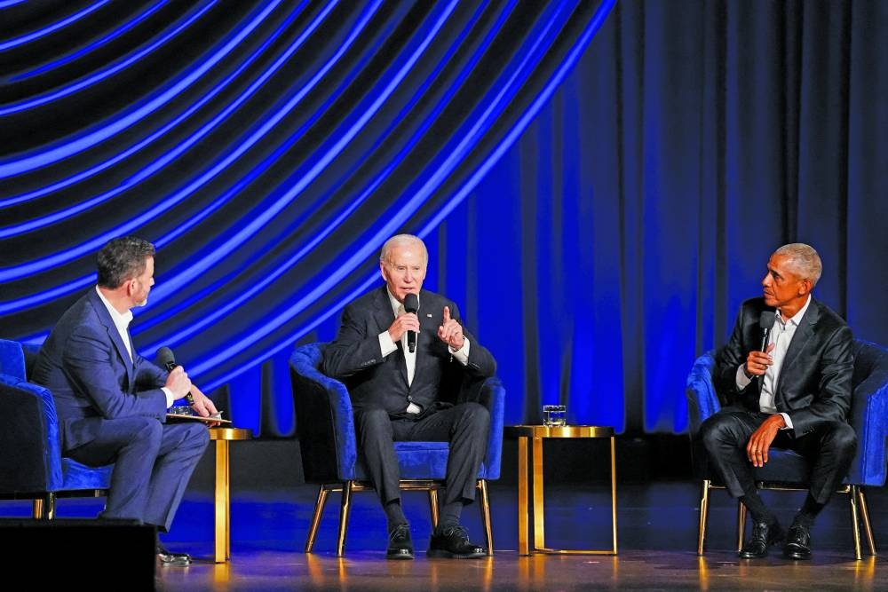 
US President Joe Biden takes part in a conversation with former president Barack Obama and late-night talk-show host Jimmy Kimmel during a star-studded campaign fundraiser at the Peacock Theatre in Los Angeles. 