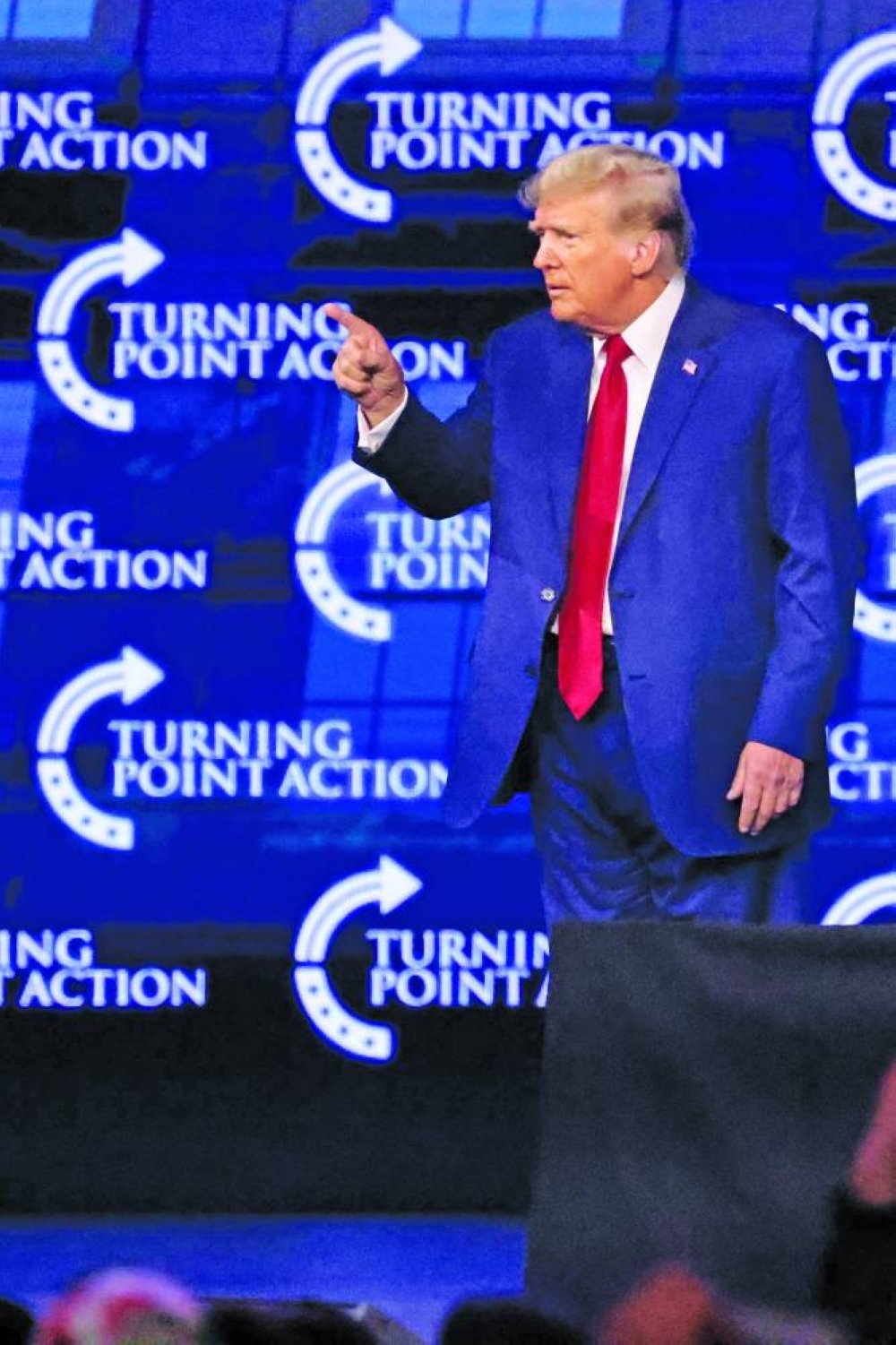 Donald Trump gestures as he finishes speaking during the ‘Turning Point: The People’s Convention’ at Huntington Place Convention Centre in Detroit.