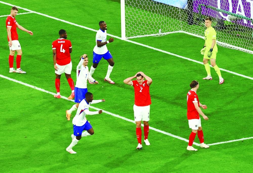 Austria’s Maximilian Woeber looks dejected after he scores France first with an own goal on Monday. (Reuters)