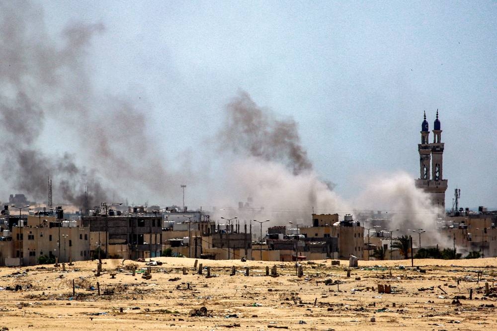 Smoke plumes billow during ongoing battles in the Sultan neighbourhood in the northwest of Rafah, on Tuesday. AFP
