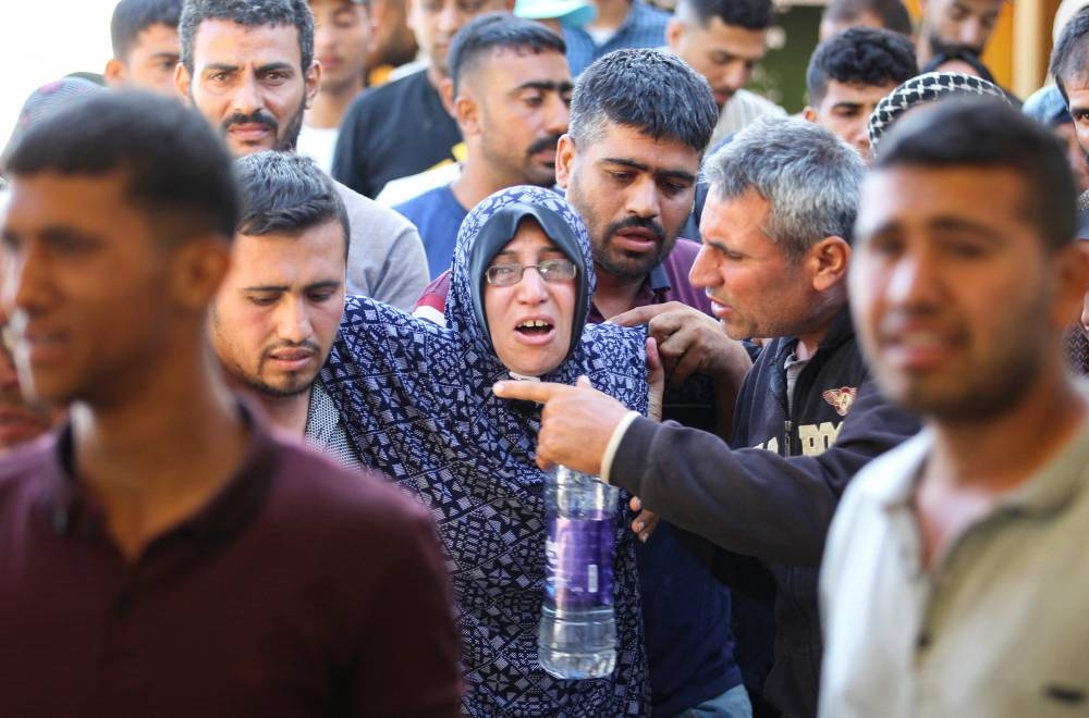 A mourner reacts during the funeral of Palestinians, killed in Israeli strikes due to a military operation in Rafah, on Tuesday. REUTERS