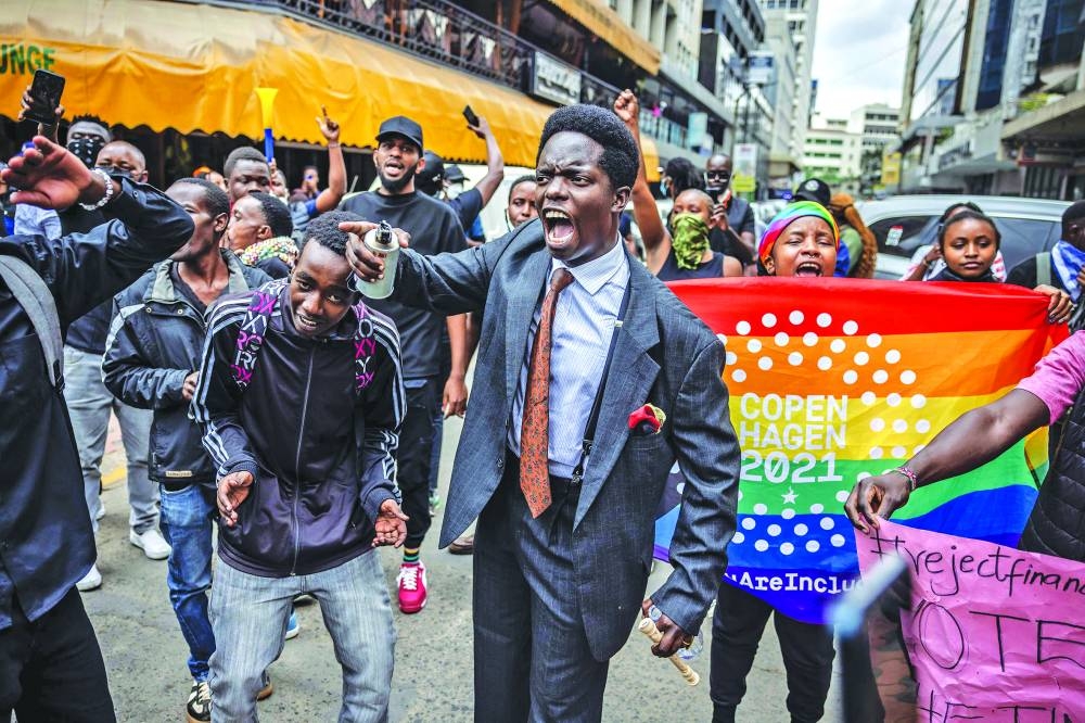 
Protesters chant anti-government slogans during a demonstration against tax hikes in downtown Nairobi. 