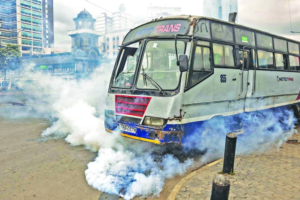 
A damaged bus is seen during the riots. 