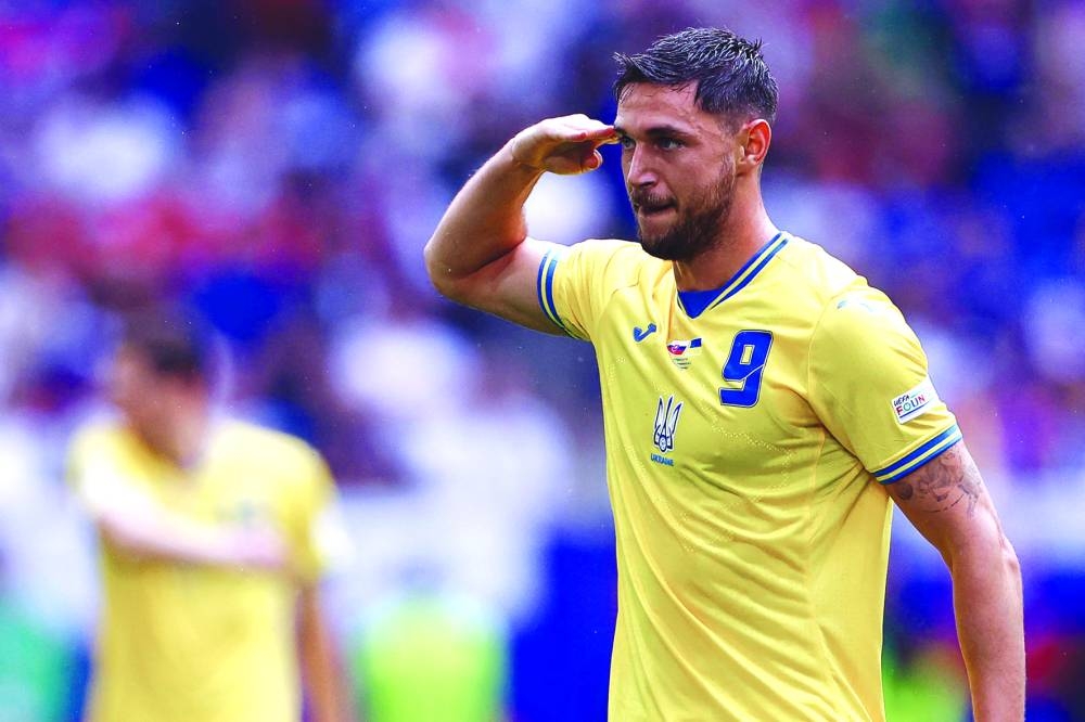 Ukraine's forward #09 Roman Yaremchuk celebrates scoring his team's second goal during the UEFA Euro 2024 Group E football match between Slovakia and Ukraine at the Duesseldorf Arena in Duesseldorf on Friday. (AFP)