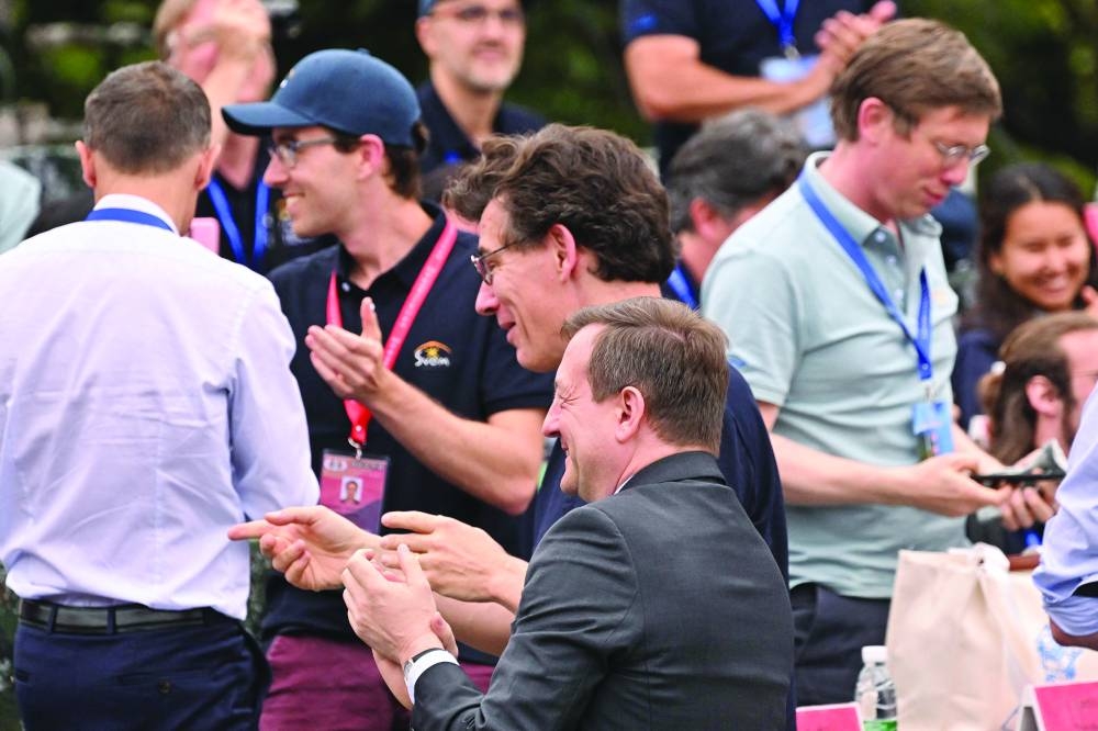 French ambassador to China Bertrand Lortholary (front centre) and National Centre for Space Studies President Philippe Baptiste (back centre) applaud following the launch. (AFP)