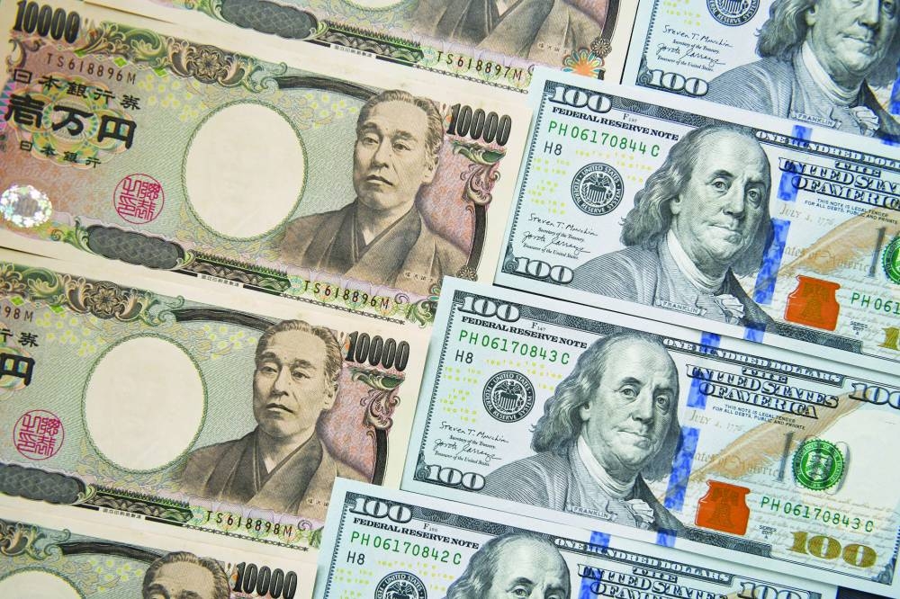 Japanese yen and US dollar banknotes are arranged for a photograph in Tokyo. The dollar’s resilience kept the pressure on peers this week, including the yen. The Japanese currency weakened for a 10th session in 11 on Friday, ending the session at 159.80 against the greenback — just shy of the closely watched 160 level.