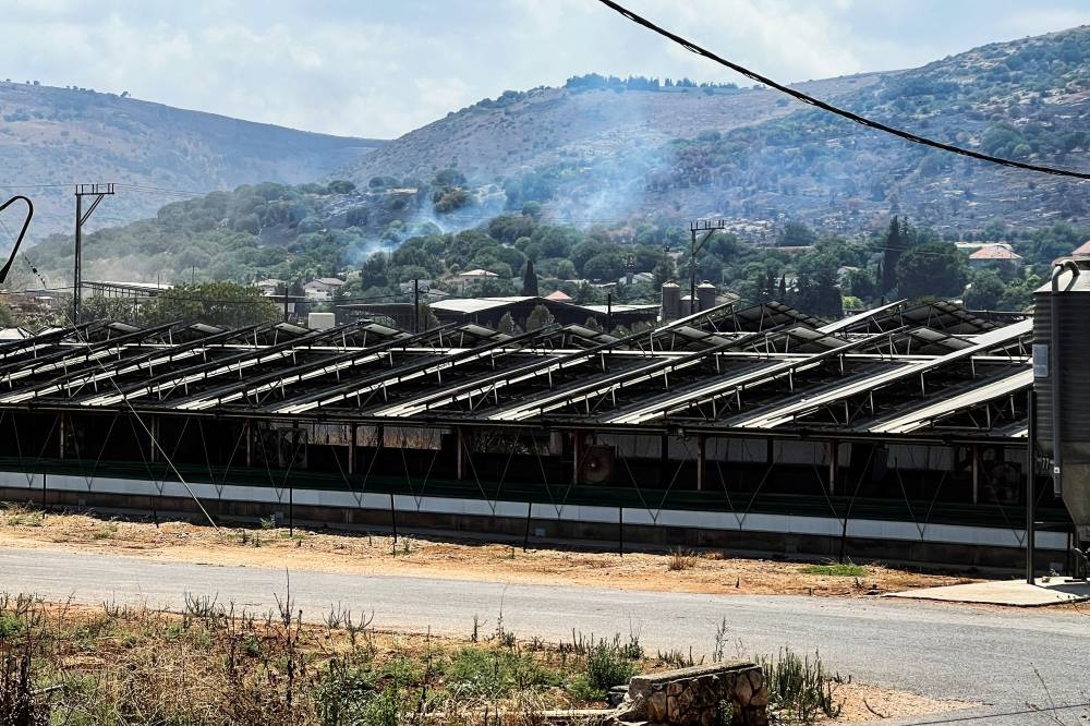 Smoke rises on the Israeli side of its border with Lebanon following a drone attack from Lebanon, amid cross-border hostilities between Hezbollah and Israeli forces, yesterday.