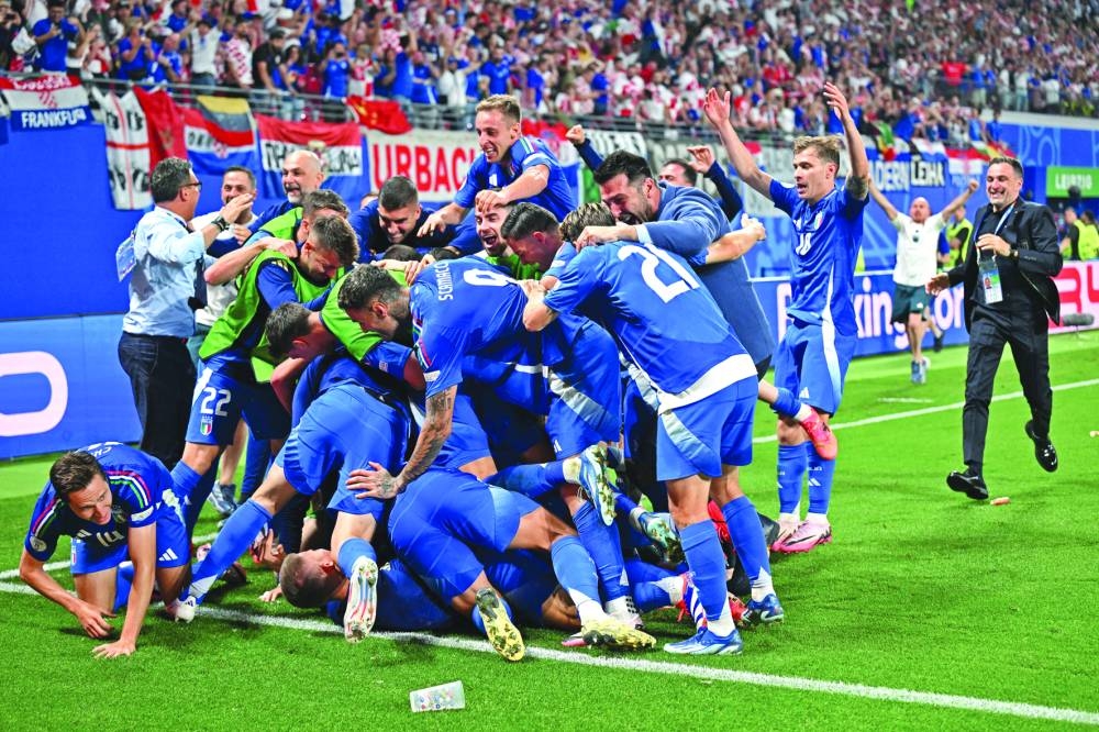 Italy’s Mattia Zaccagni celebrates scoring their first goal with teammates against Croatia at Leipzig Stadium, Leipzig, Germany, on Monday. (Reuters)