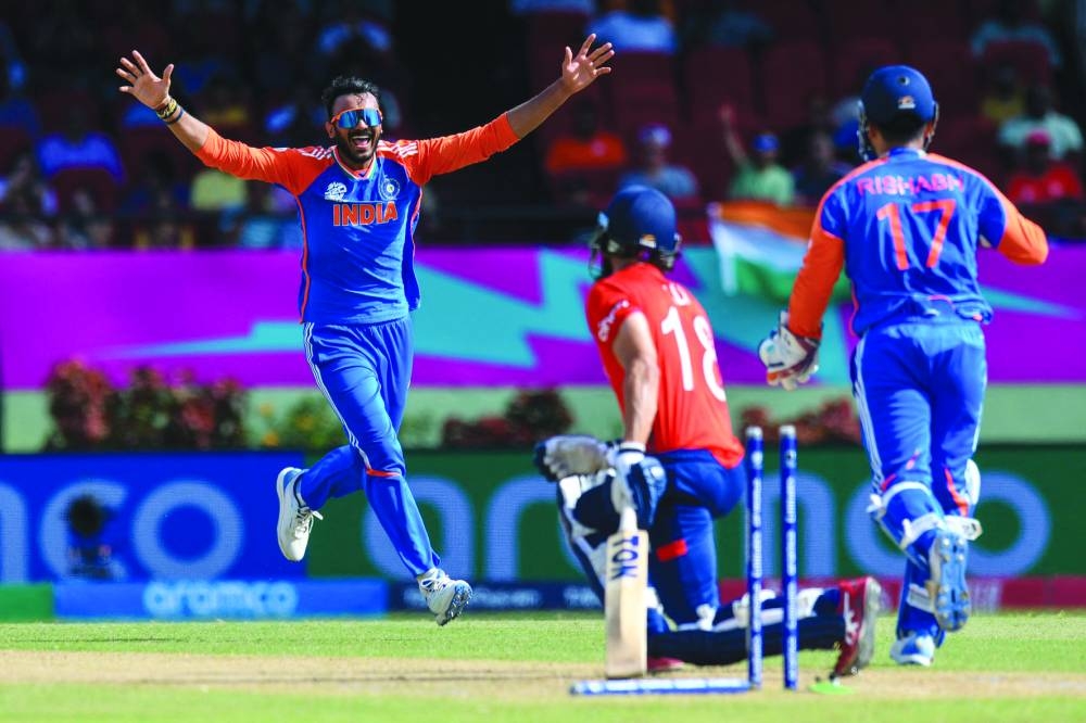 Axar Patel (left) of India celebrates the dismissal of Moeen Ali of England during the ICC Twenty20 World Cup 2024 semi-final at Providence Stadium in Georgetown, Guyana, on Thursday. (AFP)