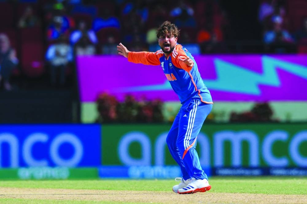 Kuldeep Yadav of India celebrates the dismissal of Chris Jordan of England during the ICC Twenty20 World Cup 2024 semi-final at Providence Stadium in Georgetown, Guyana, on Thursday. (AFP)