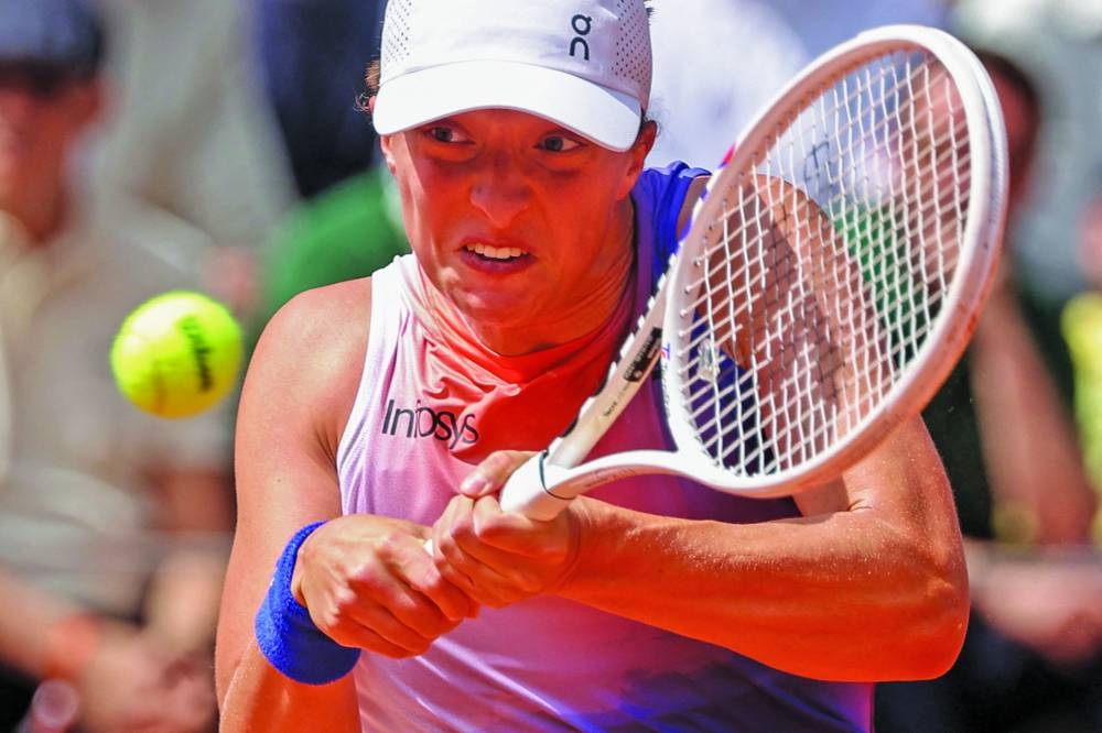 
Poland’s Iga Swiatek will be desperate to make a major impact on her weakest surface at Wimbledon after a stellar clay court season underlined her dominance of the women’s game. (AFP) 