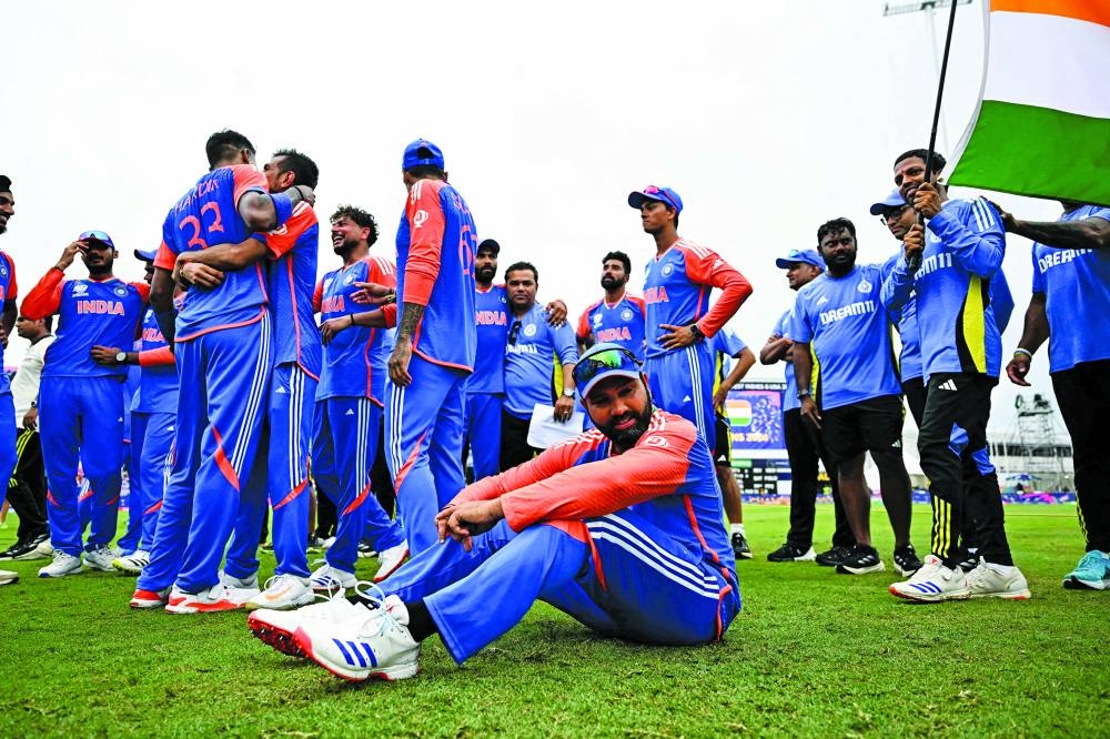 India’s captain Rohit Sharma (seated) is seen after winning ICC Twenty20 World Cup 2024 final against South Africa at Kensington Oval in Bridgetown, Barbados, on Saturday. (AFP)