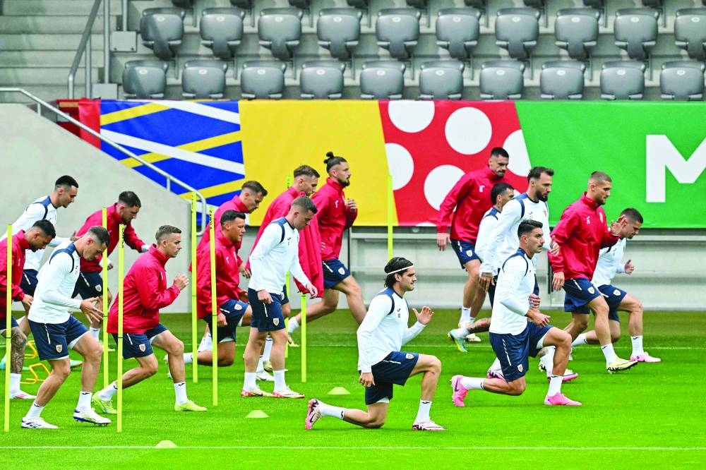 Romania’s players attend a training session in Munich on Monday. (AFP)