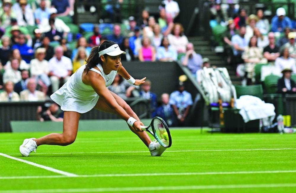 Switzerland’s Stan Wawrinka returns against Britain’s Charles Broom during their match on Monday. (AFP) Britain’s Emma Raducanu returns against Mexico’s Renata Zarazua during their singles match on the first day of the 2024 Wimbledon Championships in southwest London on Monday. (AFP)