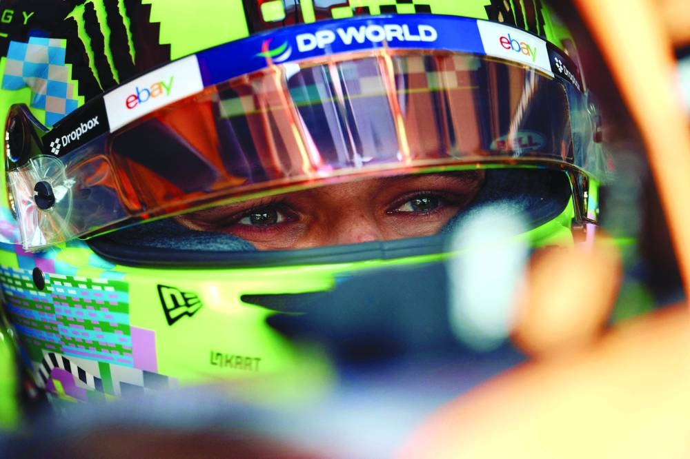 McLaren's British driver Lando Norris gets ready to take part in the second practice session ahead of the Formula One British Grand Prix at the Silverstone motor racing circuit in Silverstone, central England, on July 5, 2024. (AFP)