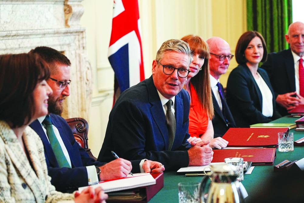 Britain's Prime Minister Sir Keir Starmer chairs the first meeting of his cabinet in 10 Downing Street, Saturday.