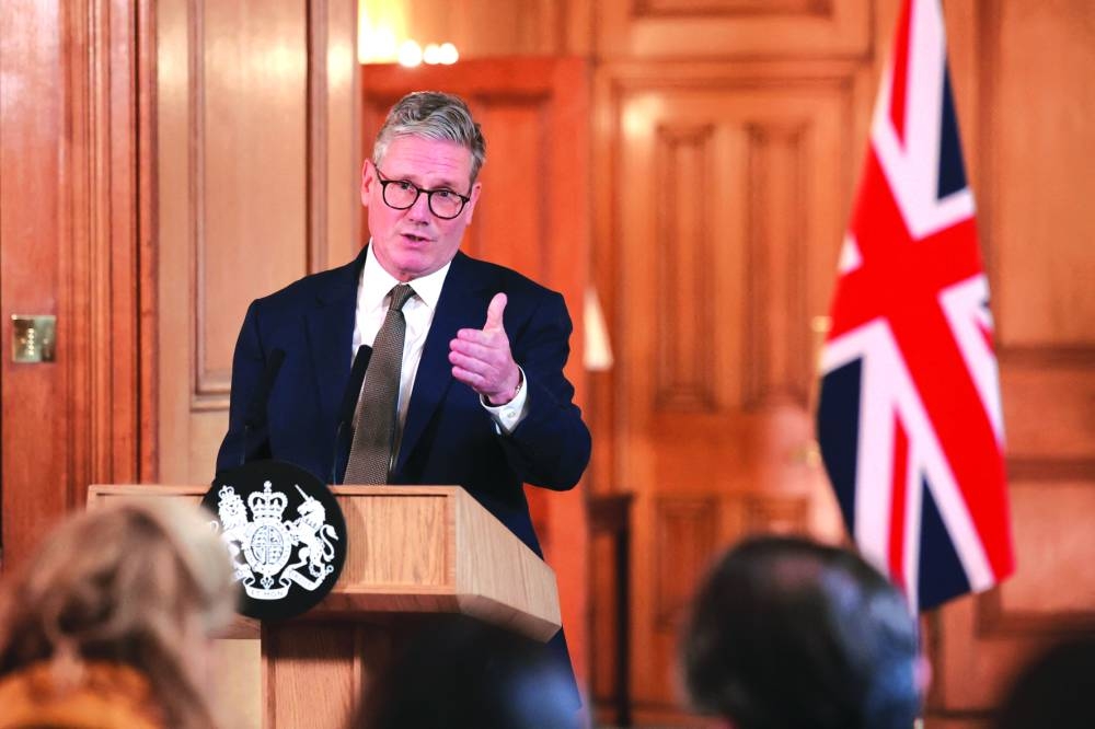 British Prime Minister Keir Starmer delivers a speech, following his first cabinet meeting as Prime Minister, in London, Saturday.