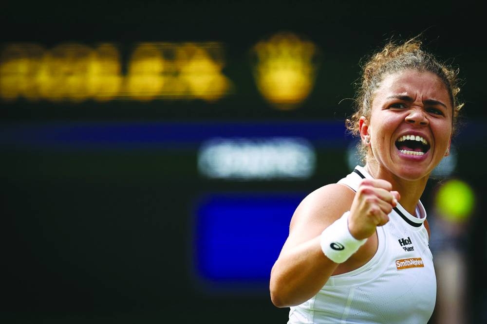 Italy’s Jasmine Paolini celebrates winning a point in the third set against Croatia’s Donna Vekic during their Wimbledon semi-final. (AFP)