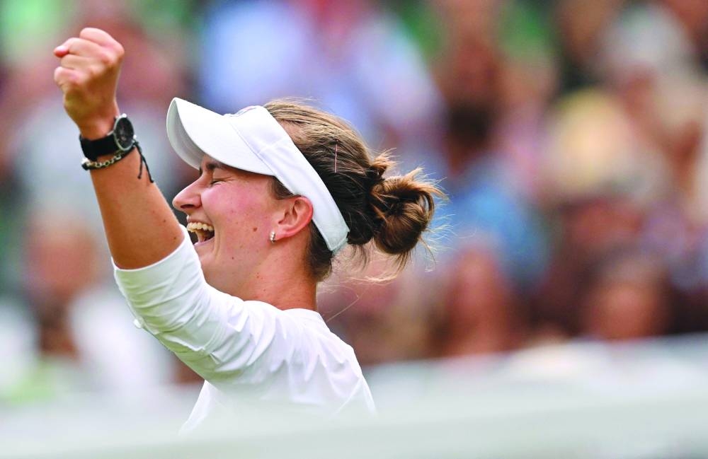 Czech Republic’s Barbora Krejcikova celebrates winning against Kazakhstan’s Elena Rybakina during their Wimbledon semi-final on Thursday. (AFP)