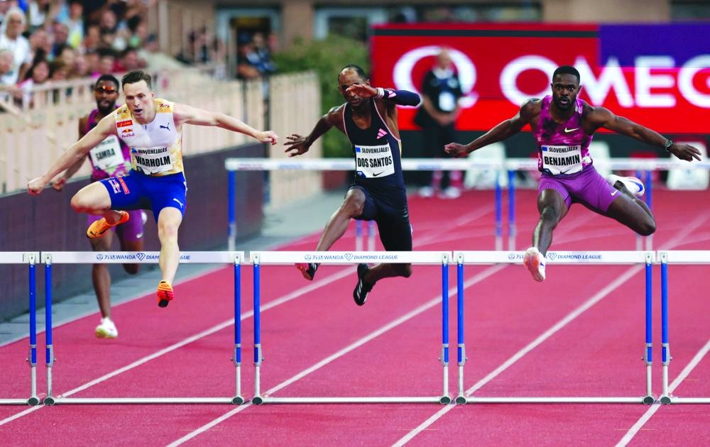 Norway’s Karsten Warholm (left), Brazil’s Alison dos Santos (centre) and Rai Benjamin of the US in action during the men’s 400m hurdles during the in Monaco Diamond League round on Friday. (Reuters)