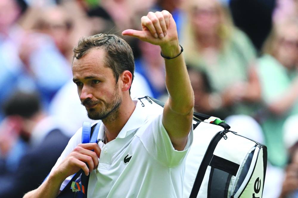 Russia’s Daniil Medvedev waves to the crowd as he leaves Centre Court following his defeat against Spain’s Carlos Alcaraz in the semi-final on Friday. (AFP)