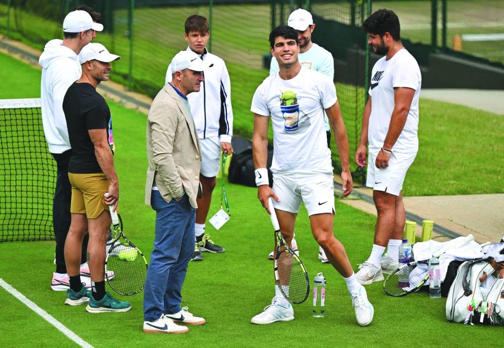 Spain’s Carlos Alcaraz takes part in a training session on Saturday, on the eve of Wimbledon final at the Aorangi Practice Courts at The All England Lawn Tennis and Croquet Club in Wimbledon, southwest London. (AFP)