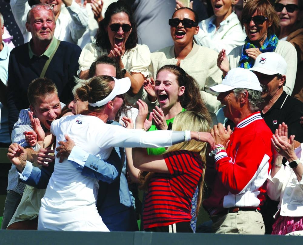 
Barbora Krejcikova celebrates with family and coaches after winning Wimbledon final against Italy’s Jasmine Paolini. (Reuters) 