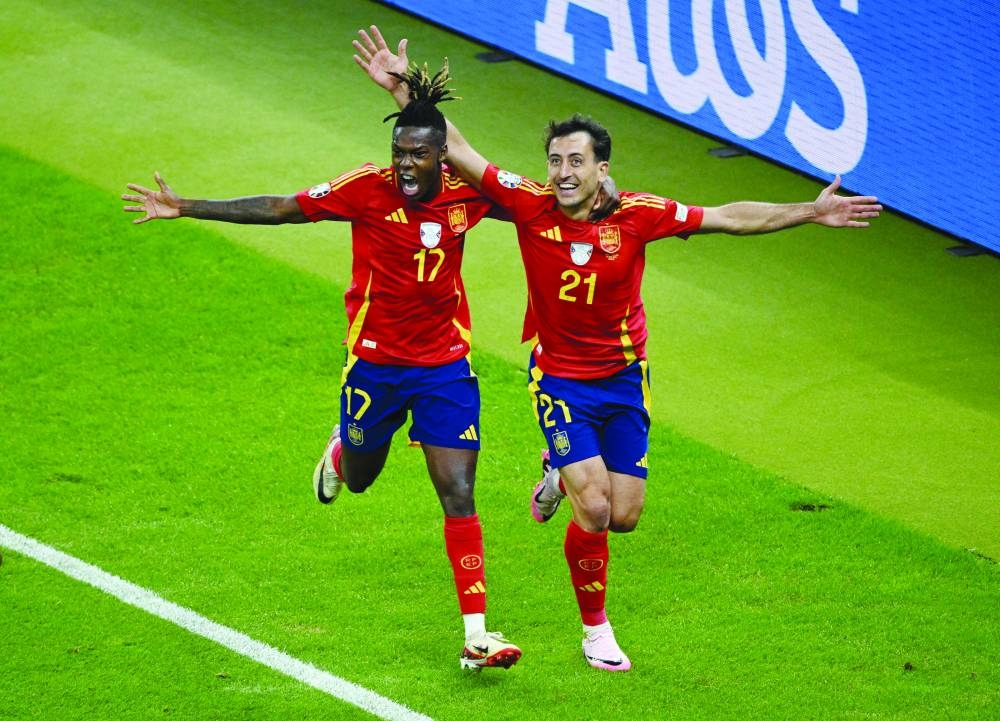 
Spain’s Mikel Oyarzabal (right) celebrates scoring their second goal with Nico Williams yesterday. (Reuters) 