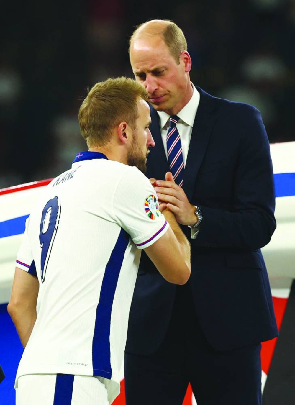
England’s Harry Kane shakes hands with Britain’s Prince William, the Prince of Wales and President of the English Football Association, after receiving his runners up medal yesterday. (Reuters) 