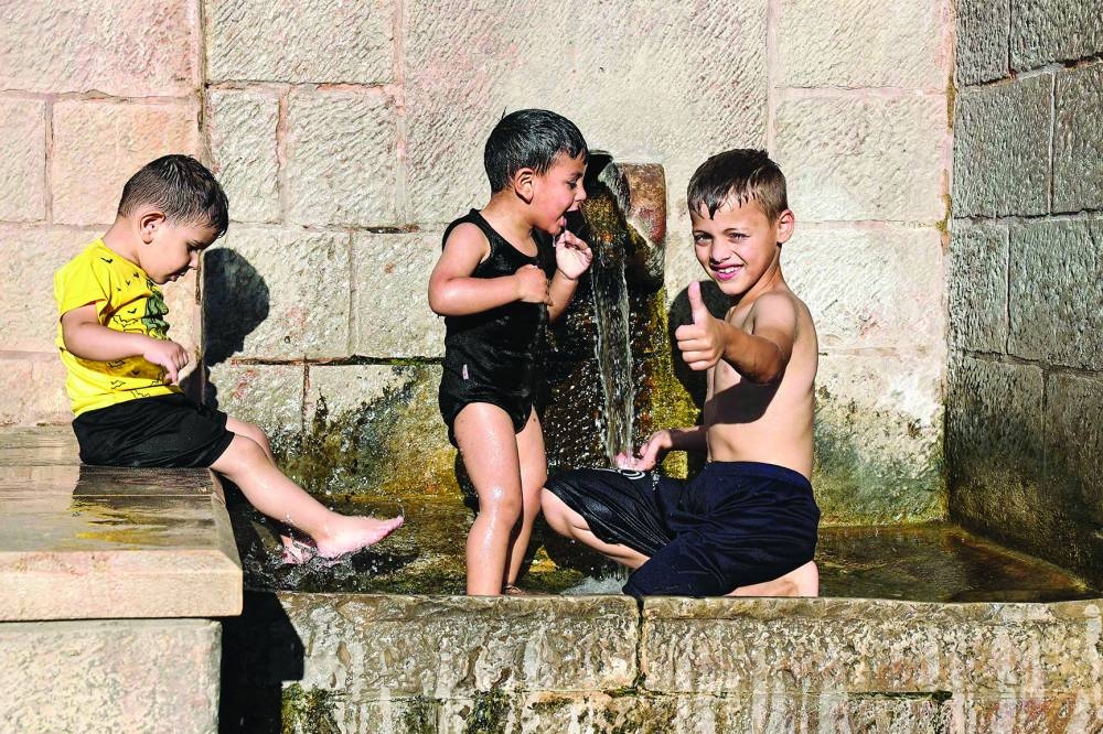 
Palestinian children play in a Roman-era fountain in Battir, a Unesco heritage village in the occupied West Bank, south of Jerusalem. 