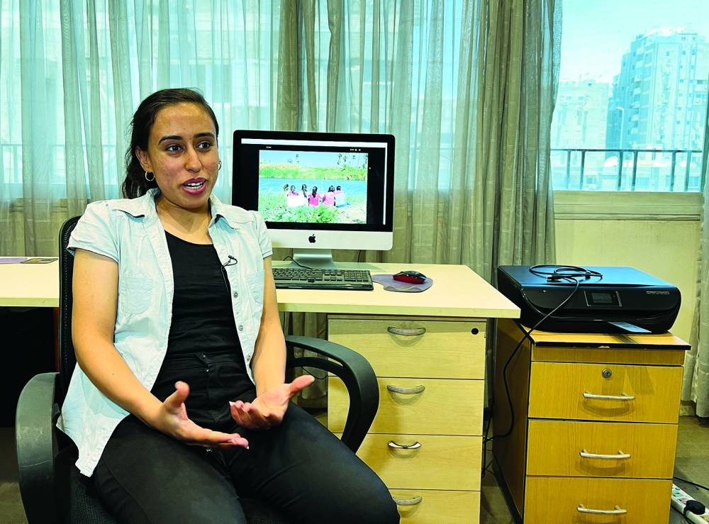 
Ayman El Amir, director and producer of the Egyptian documentary film The Brink of Dreams, speaks during an interview in Cairo, Egypt. Right: Magda Masoud, a member of the “Panorama El Barsha” street theatre troupe, featured in the documentary film The Brink of Dreams, speaks during the interview.  