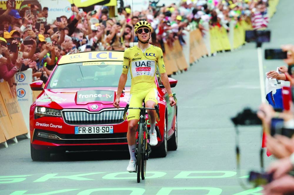 UAE Team Emirates’ Tadej Pogacar celebrates winning stage 19 of the 111th Tour de France on Friday. (Reuters) 