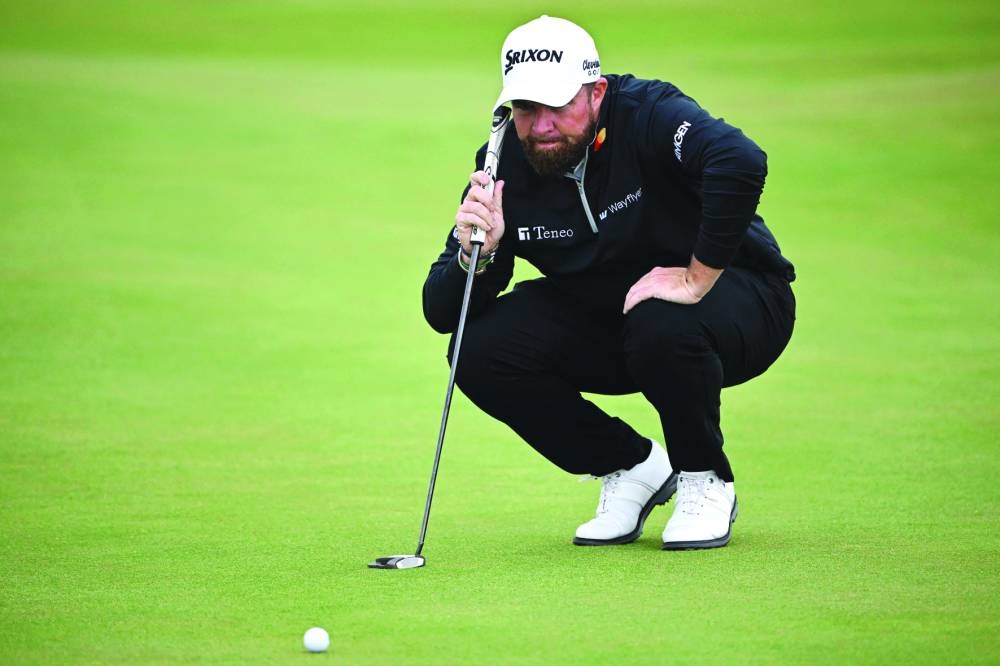 Ireland’s Shane Lowry lines up his putt on the 3rd green during his second round of the 152nd British Open Golf Championship at Royal Troon on the south west coast of Scotland on Friday. (AFP)