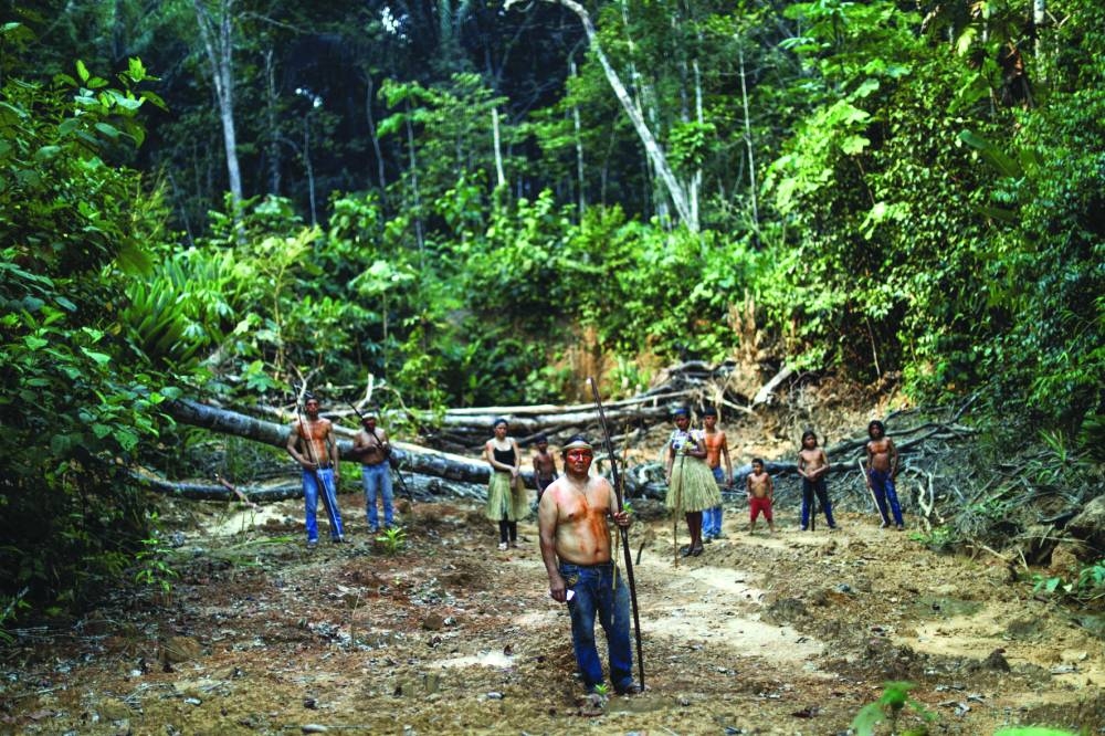 File photo: Indigenous Mura people pose for a picture in a deforested area of a non-demarcated indigenous land in the Amazon rainforest near Humaita, Amazonas State, Brazil, on August 20, 2019. 