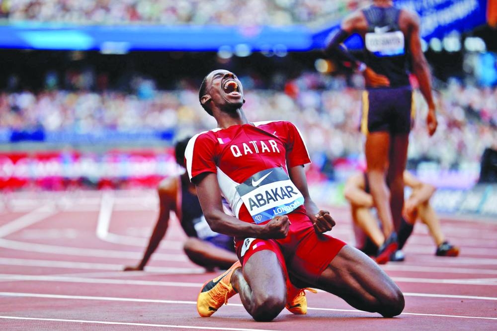 Qatar’s Ismail Doudai Abakar celebrates after achieving a personal best in the 400m hurdles during the Diamond League meeting in London yesterday. (AFP) 