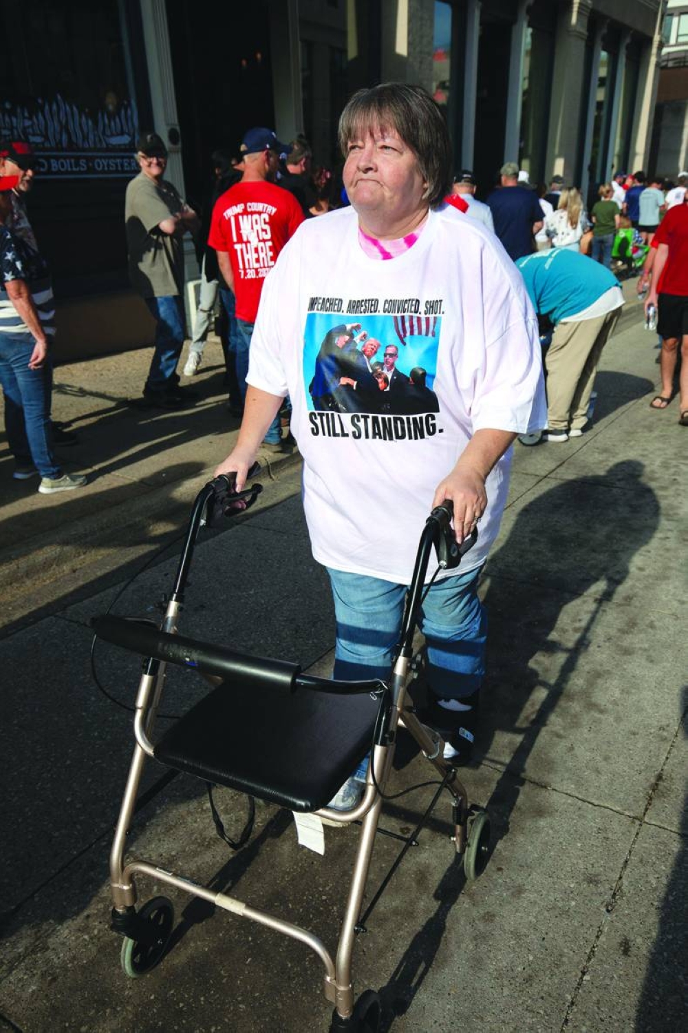 A rally-goer waits for the doors to open for a rally featuring Trump and his running mate JD Vance at the Van Andel Arena in Grand Rapids, Michigan. – AFP