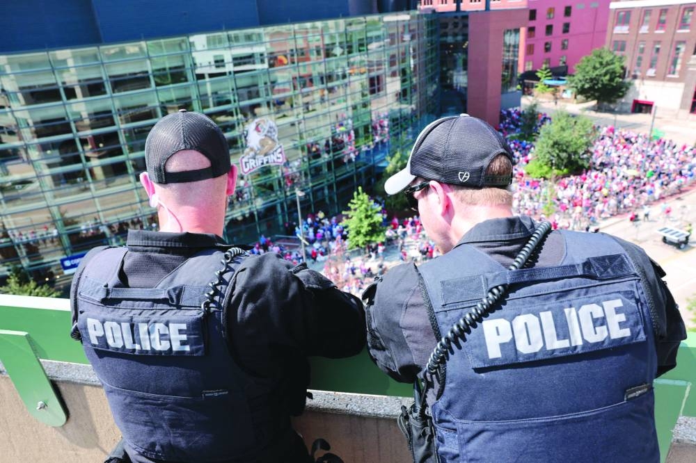 
Police officers are seen providing security before the Trump campaign rally at Van Andel Arena in Grand Rapids, Michigan. – AFP 