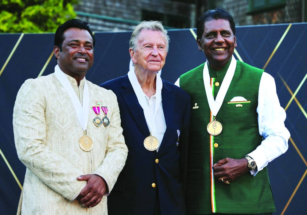 
Leander Paes, Richard Evans and Vijay Amritraj pose after getting inducted into the International Tennis Hall of Fame in Newport, Rhode Island, US. (Reuters) 