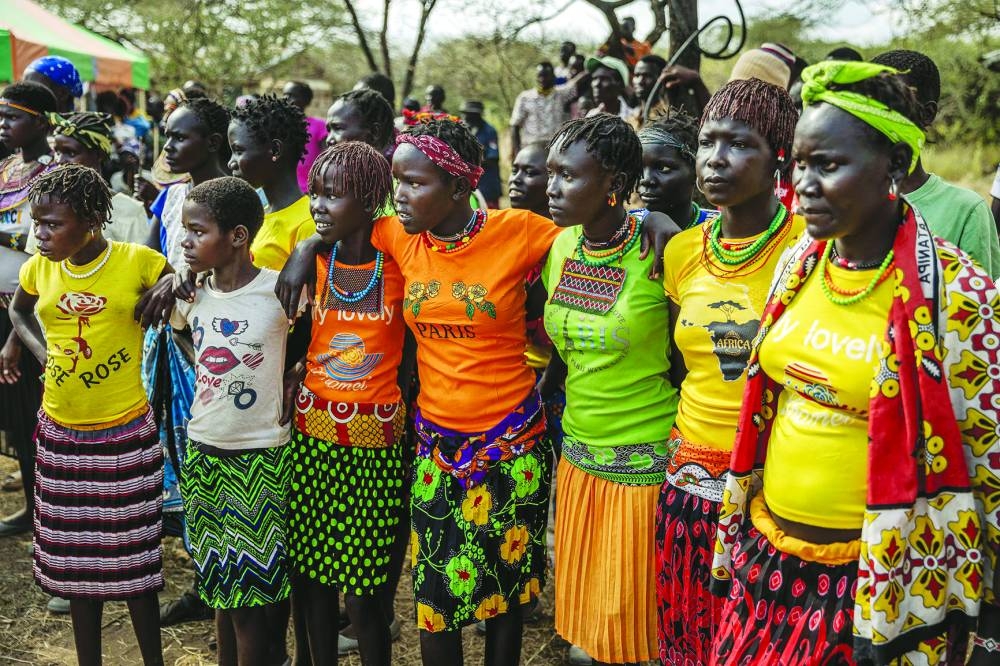 Women wear traditional attires and colourful clothes as they attend the community celebrations to honour the arrival of several wild giraffes as part of a wildlife translocation exercise in Ruko Conservancy.