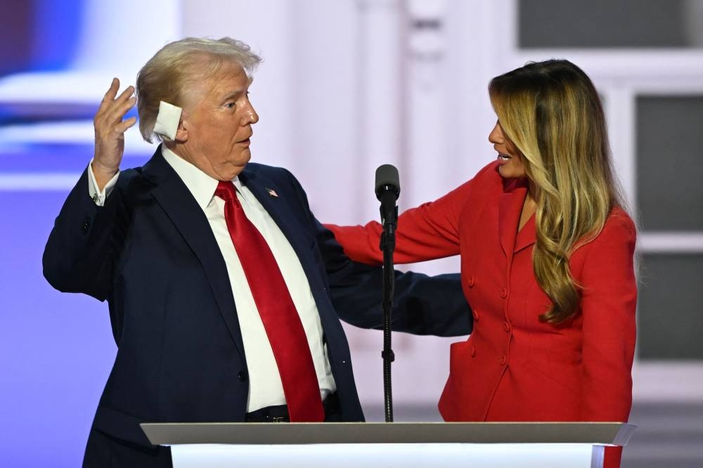 Former US first lady Melania Trump joins former US president and 2024 Republican presidential candidate Donald Trump onstage after he accepted his party’s nomination on the last day of the 2024 Republican National Convention at the Fiserv Forum in Milwaukee, Wisconsin, on Thursday. (AFP)