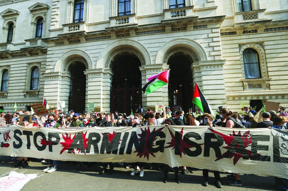 
Pro-Palestinian demonstrators from ‘Workers for a Free Palestine’ gather outside the Foreign, Commonwealth and Development Office, in a protest against arms exports to Israel, in London, Britain, yesterday. 
