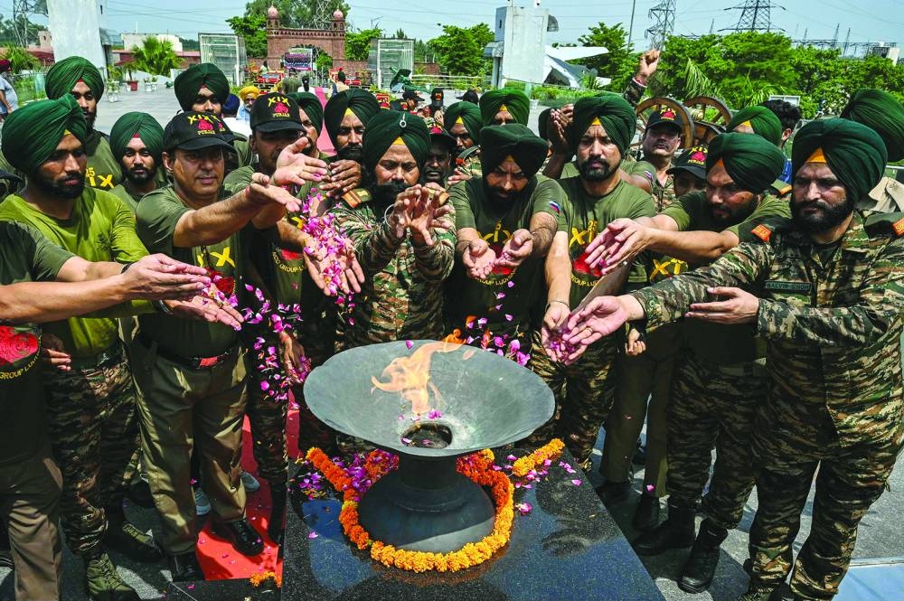 Indian army personnel pay their tributes on the occasion of ‘Kargil Vijay Diwas’ or Kargil war anniversary, at the Punjab State War Heroes’ Memorial and Museum in Amritsar yesterday. 