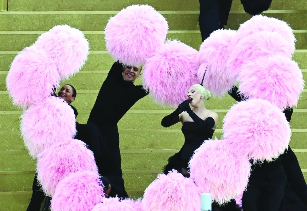 US' singer Lady Gaga sings a song at the Sully bridge area before the opening ceremony of the Paris 2024 Olympic Games in Paris on Friday. (AFP)