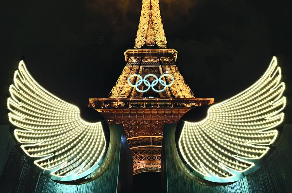A general view showing wings and the Olympic rings on the Eiffel Tower during the opening ceremony. (Reuters)